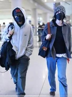 王菲谢霆锋同框现身机场